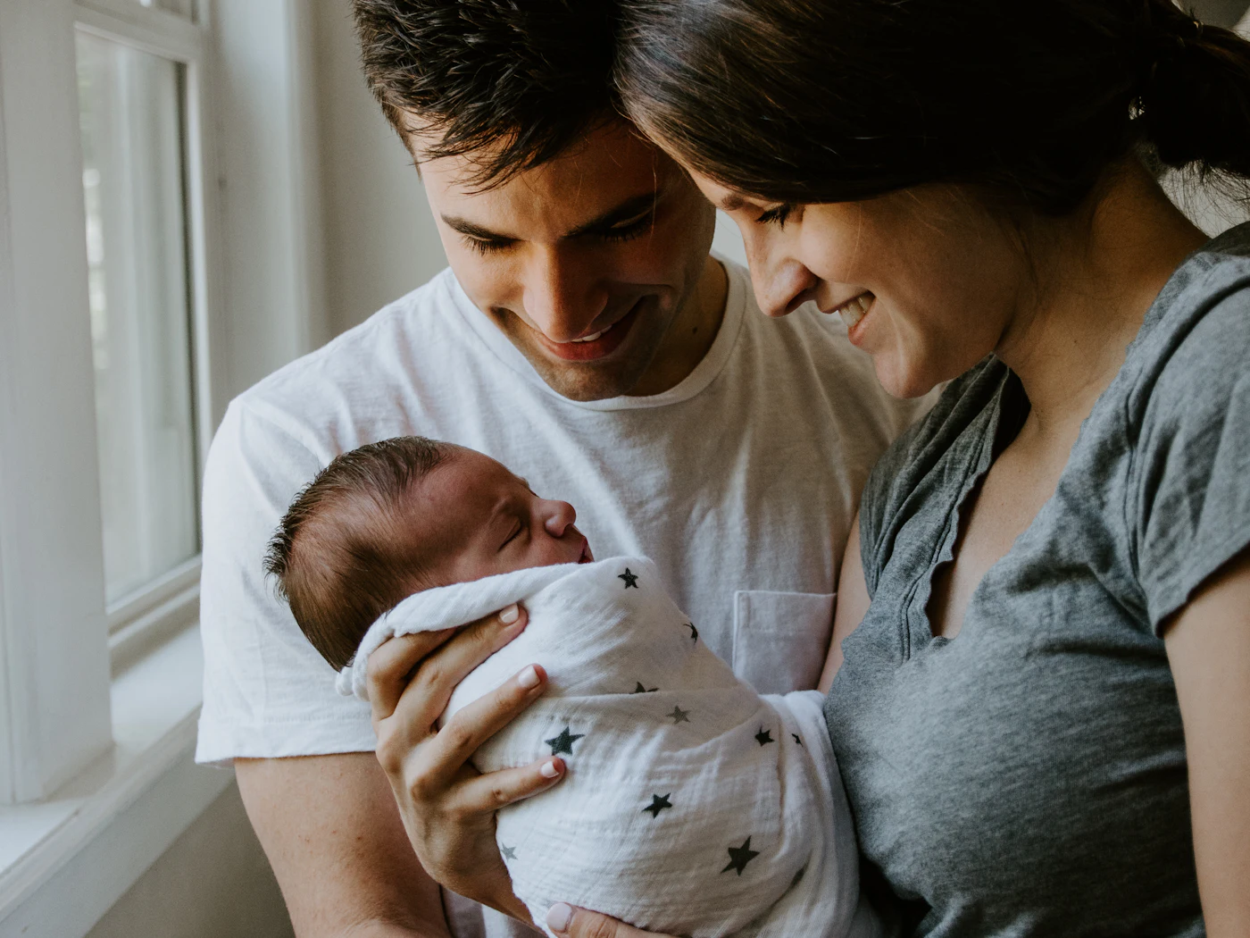 Young parents at home with their child